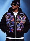 Man wearing black Diplomats iced patch zip-up hoodie, front view with Dipset and Harlem patch graphics