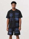 Man wearing washed black Diplomats Bike Life matching t-shirt and shorts set with racing-inspired graphics