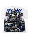 White oversized cotton graphic t-shirt with 'Pray For The Trap' streetwear design by Dyce Payso, featuring trap house scene, G-Wagon, and jumbo screen print detail"
