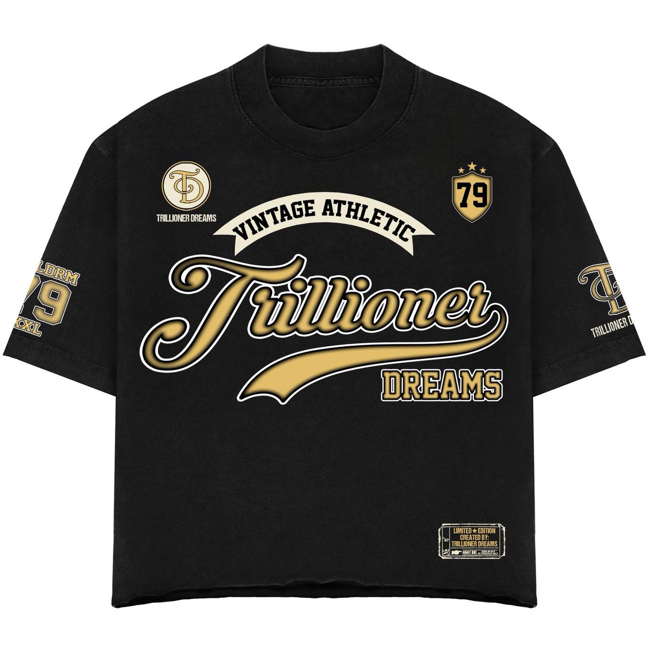 A black short-sleeve t-shirt with gold and white graphic text reading 'Vintage Athletic Trillioner Dreams' on the front, plus '79' and 'Tallented Dreams' graphics on the sleeves and chest.