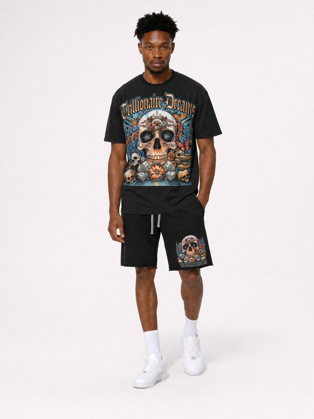 "Man wearing black Trillionaire Dreams Floral Skull matching tee and shorts set with gothic logo and NYC skull graphic"